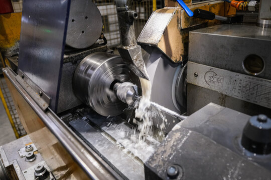 Lathe cutting into the metal inside a precision rifle factory near Annecy, France