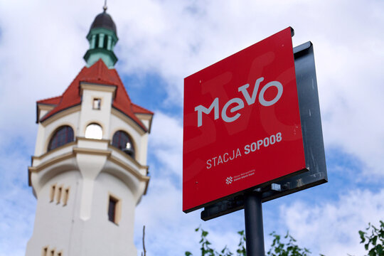 Bike-sharing station for red MEVO shared bicycles and electric bikes manufactured by Segway, convenient and sustainable urban transportation on July 23, 2026 in Gdynia, Poland.