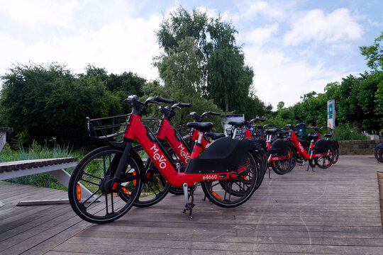 Bike-sharing station for red MEVO shared bicycles and electric bikes manufactured by Segway, convenient and sustainable urban transportation on July 23, 2026 in Gdynia, Poland.
