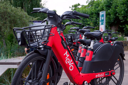 Bike-sharing station for red MEVO shared bicycles and electric bikes manufactured by Segway, convenient and sustainable urban transportation on July 23, 2026 in Gdynia, Poland.