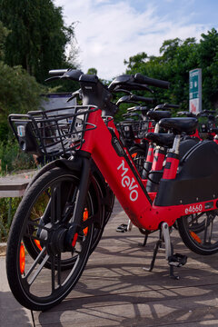Bike-sharing station for red MEVO shared bicycles and electric bikes manufactured by Segway, convenient and sustainable urban transportation on July 23, 2026 in Gdynia, Poland.
