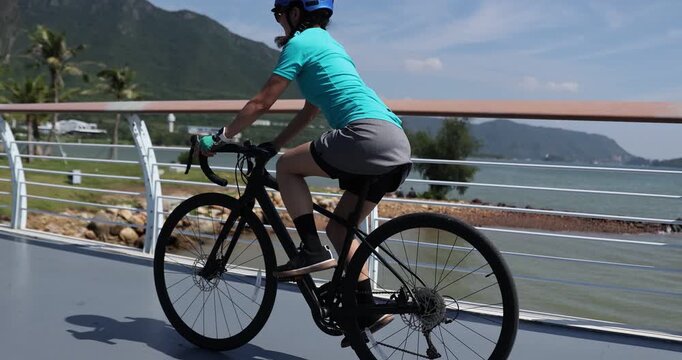 Riding bike on the seaside road