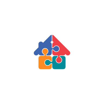 Creative logo design featuring a house shape constructed from interlocking colorful puzzle pieces (blue, red, orange, teal). Perfect for real estate, kids education, or property solutions.
