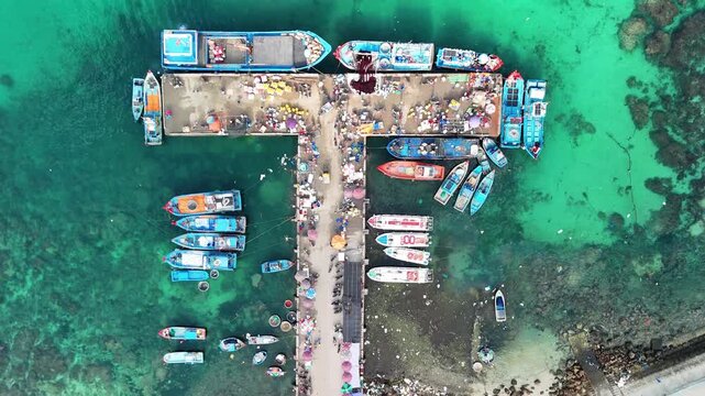 Drone view of Ly Son Port with boats connecting to Dao Be