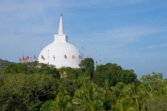 View of the ancient white dagoba (Maha Seya Stupa) on a sunny day. Mihintale, Sri Lanka
