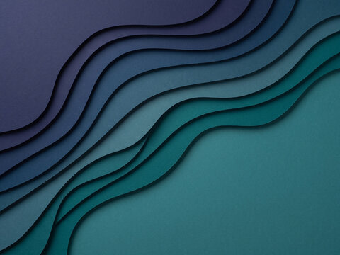 Layered paper cut waves in indigo and teal, minimal top view abstract background with shadows