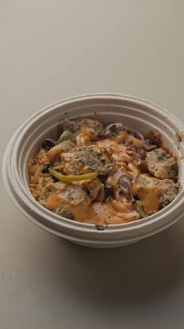 Nutritious Healthy Chicken Rice Bowl with Grilled Chicken, Steamed Rice and Fresh Vegetables, Overhead Close-Up Food Shot