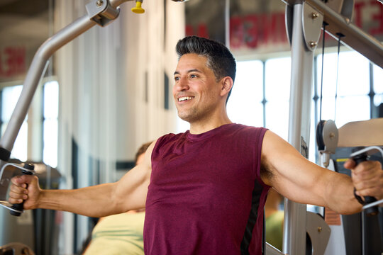 Man during his Chest Fly Machine workout at gym