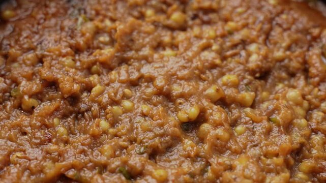 Freshly Cooked Healthy Millet Khichdi Served Hot in a Black Bowl, Close-Up Food Shot.