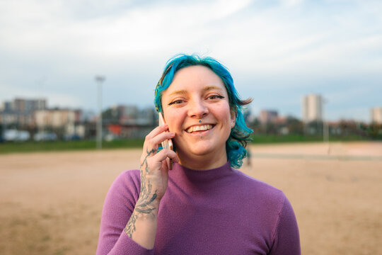 Young woman laughing during phone call