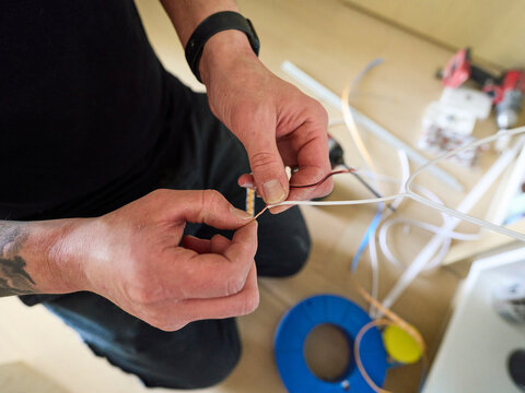 Electrician Working with LED Lighting Cable