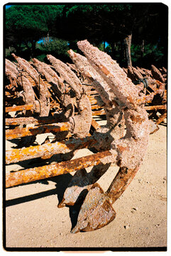 Rusted Anchors On Beach