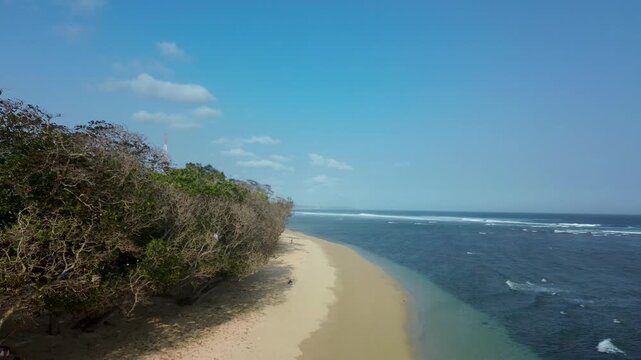 Pristine Vista of Tropical Indian Ocean Shoreline at Balekambang Beach Indonesia