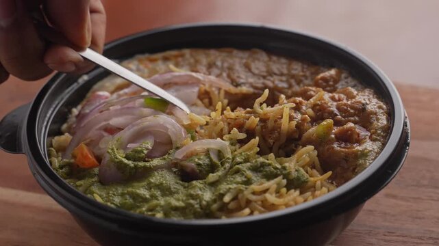 Aromatic Spiced Masala Rice Served with Rich Indian Curry and Fresh Sliced Onion Topping in a Bowl, Close-Up Food Shot.
