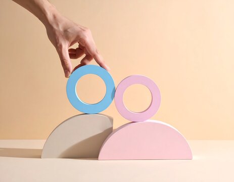 Hand Adjusting Equality Symbol on Gender Blocks on Soft Beige Background, Gender Equality, Equal Rights and Social Justice Concept