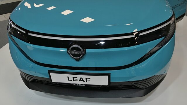 Upper front view of front mask of modern japanese battery electric crossover SUV car Nissan Leaf third generation, displayed as premiere on Car Expo in Nitra, Slovakia, october 2026.