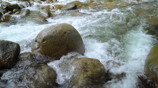 White Water Rapids Crashing Around Giant Boulder