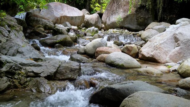 Rocky Tropical Stream Flowing Between Large Boulders