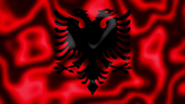 Closeup of the albanian flag with a doubleheaded eagle, showing the textured red fabric