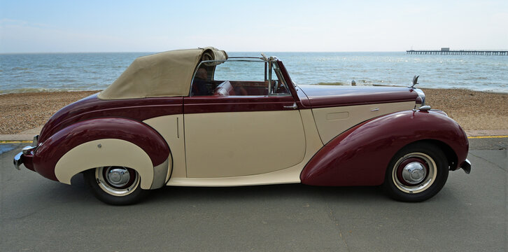 Classic  Alvis TA 21 Drophead Coup with coachwork by Tickford parked on seafront promenade