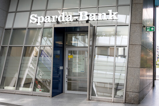 Berlin, Germany - 16 August 2026. Sparda-Bank sign mounted above a glass entrance at a modern commercial building. Banking, finance, corporate, commerce, services, customer, trust, Germany.