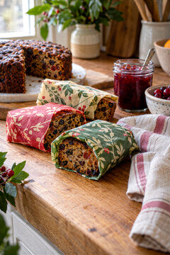 Leftover Christmas fruitcake in beeswax wraps on a kitchen counter