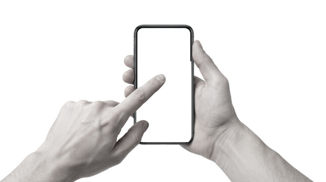 Black and white high angle view of human hands holding and touching a modern smartphone with blank white screen isolated on white background