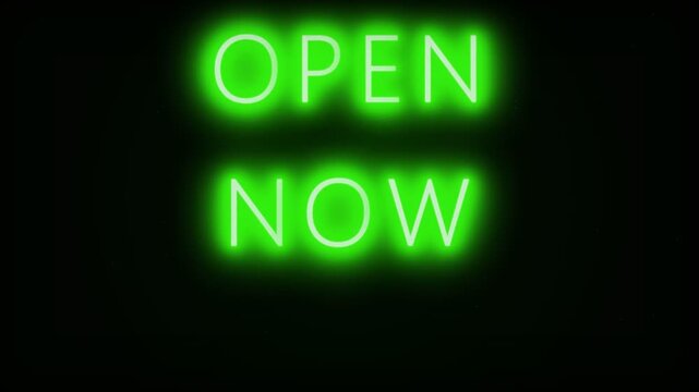 Green neon sign glowing open now text against dark background