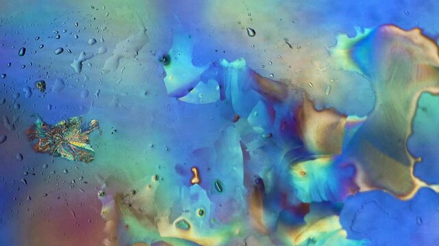 Real time crystal growth dynamic process observed under polarized light microscope showcasing rapid chemical crystallization front phase change and vibrant interference fluid pattern for study archive