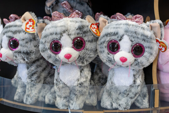 Gray TY Beanie Boos plush cats with large glittery pink eyes and bows displayed on toy store shelf. Kaliningrad, Kaliningrad Region. October 7, 2026