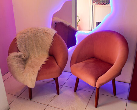 Two pink sofas with a modern design and a sheepskin rug, in Pedro II, Piau&iacute;, northeastern Brazil.