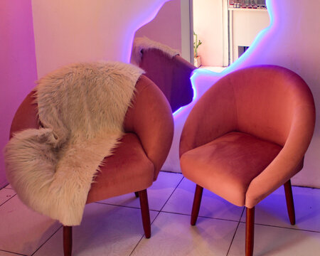Two pink sofas with a modern design and a sheepskin rug, in Pedro II, Piau&iacute;, northeastern Brazil.