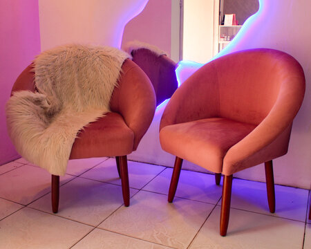 Two pink sofas with a modern design and a sheepskin rug, in Pedro II, Piau&iacute;, northeastern Brazil.