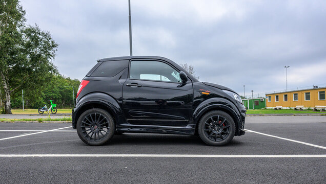 Gothenburg, Sweden - August 15 2026: Black compact Ligier microcar parked alone in urban parking lot.