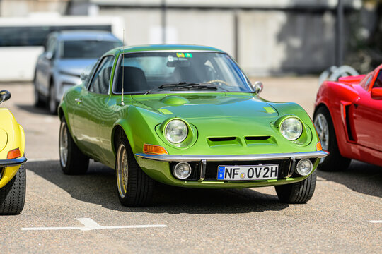 Trollh&auml;ttan, Sweden - August 22 2026: Green classic Opel GT front view at sunny car gathering.