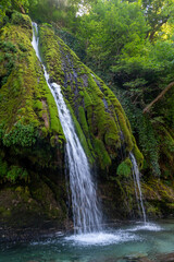 Kaghu Waterfall, located in the Samegrelo region of Georgia, A vibrant waterfall cascades down a mossy stone © k_samurkas