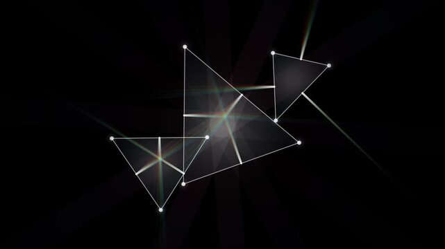 Abstract rotating glass prisms refracting rainbow light beams on dark background motion video