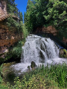 Beautiful waterfall of the Cifuentes river in the rural village of Trillo, Guadalajara, Castilla-La Mancha, Spain.