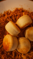Golden pan-seared scallops served on a bed of savory toasted breadcrumbs in a white bowl © shine.graphics