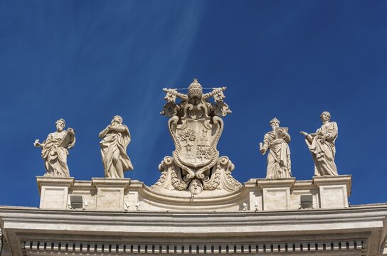 Alexander VII Coat of Arms and statues of saints Mark the Evangelist, Mary of Egypt, Ephraim and Theodosia above entrance to St. Peter's Square, Vatican, Rome, Italy