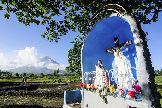 Christian statue before volcano Mayon, Legazpi, Southern Luzon, Philippines