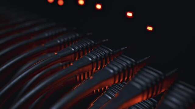 Server Cables with Flickering Red Status Lights in Dark Data Center