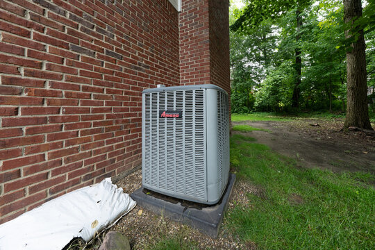 Detroit, Michigan - USA &ndash; October 4th 2026- Air conditioner condensing unit and compressor have been repaired by a certified HVAC technician