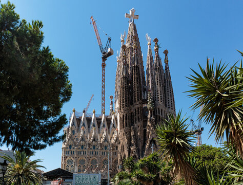 The iconic Sagrada Familia cathedral in Barcelona undergoes ongoing construction to complete its spires.