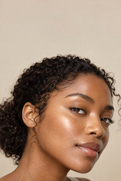 Radiant glow on dark skin cheek highlight close up vertical