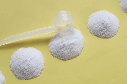 White creatine powder, used as a pre-workout supplement for gym and fitness.