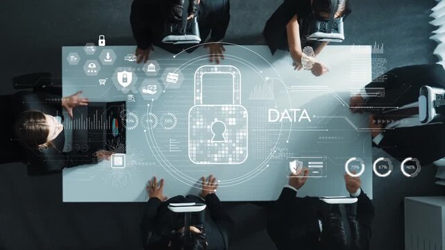 A top-down view of professionals focused on data security in a modern office. Digital graphics of locks and data analytics emphasize technology role in teamwork and innovation. Raster