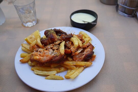 Spit roasted chicken meat, or kontosouvli, a traditional Greek food served in a restaurant