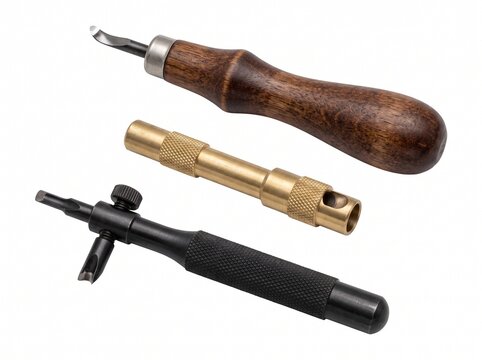 Three leather working tools including edge beveler, brass tool and adjustable stitching groover