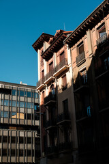 Contrasting architecture creating shadows in city street © Jorge Elizaquibel
